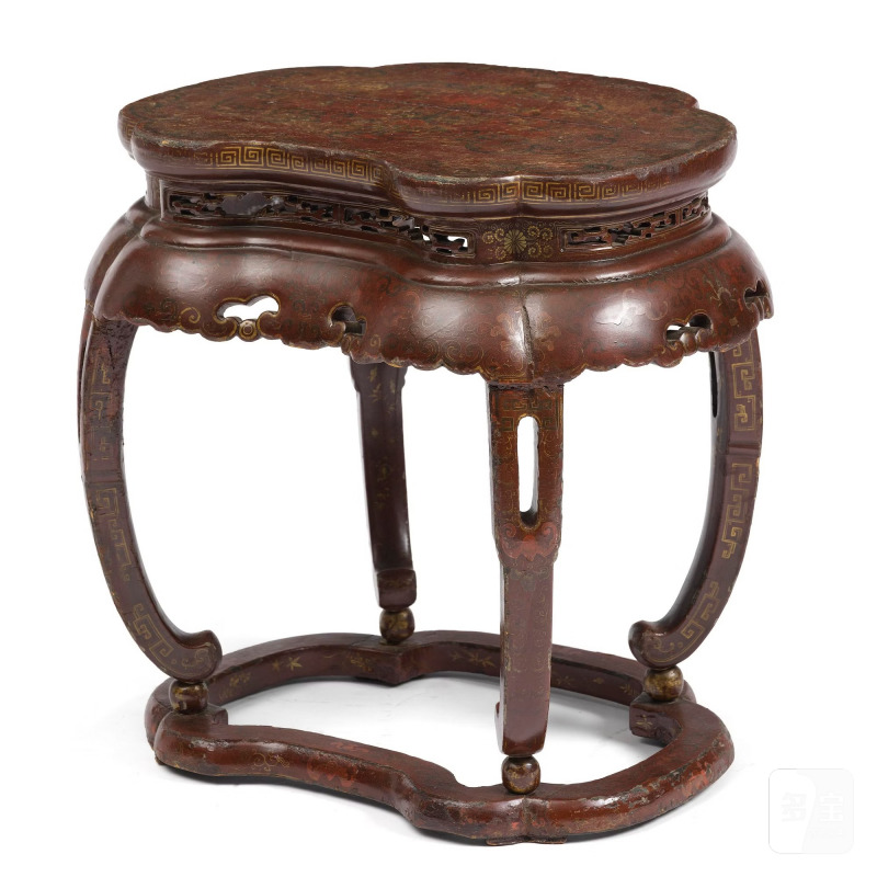 A red and gold lacquer stool,
